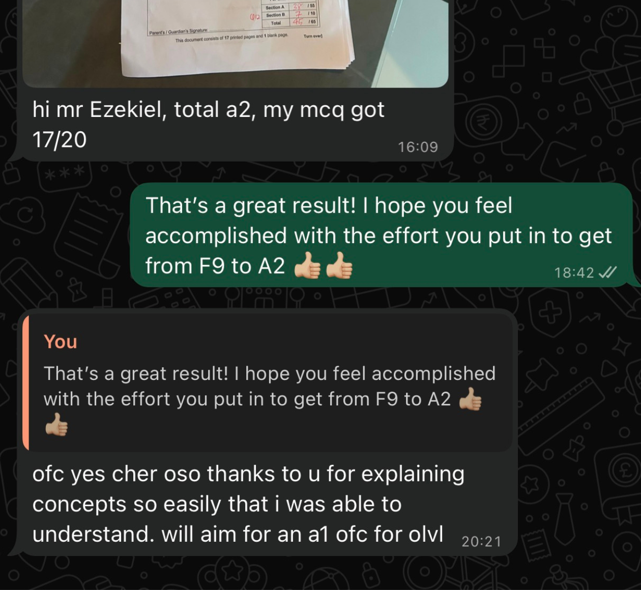 WhatsApp conversation. A photo of a marked exam script showing the section totals. Message: “hi mr Ezekiel, total a2, my mcq got 17/20”. Reply: “That’s a great result! I hope you feel accomplished with the effort you put in to get from F9 to A2” with two thumbs-up emoji. Reply to that message: “ofc yes cher oso thanks to u for explaining concepts so easily that i was able to understand. will aim for an a1 ofc for olvl”.